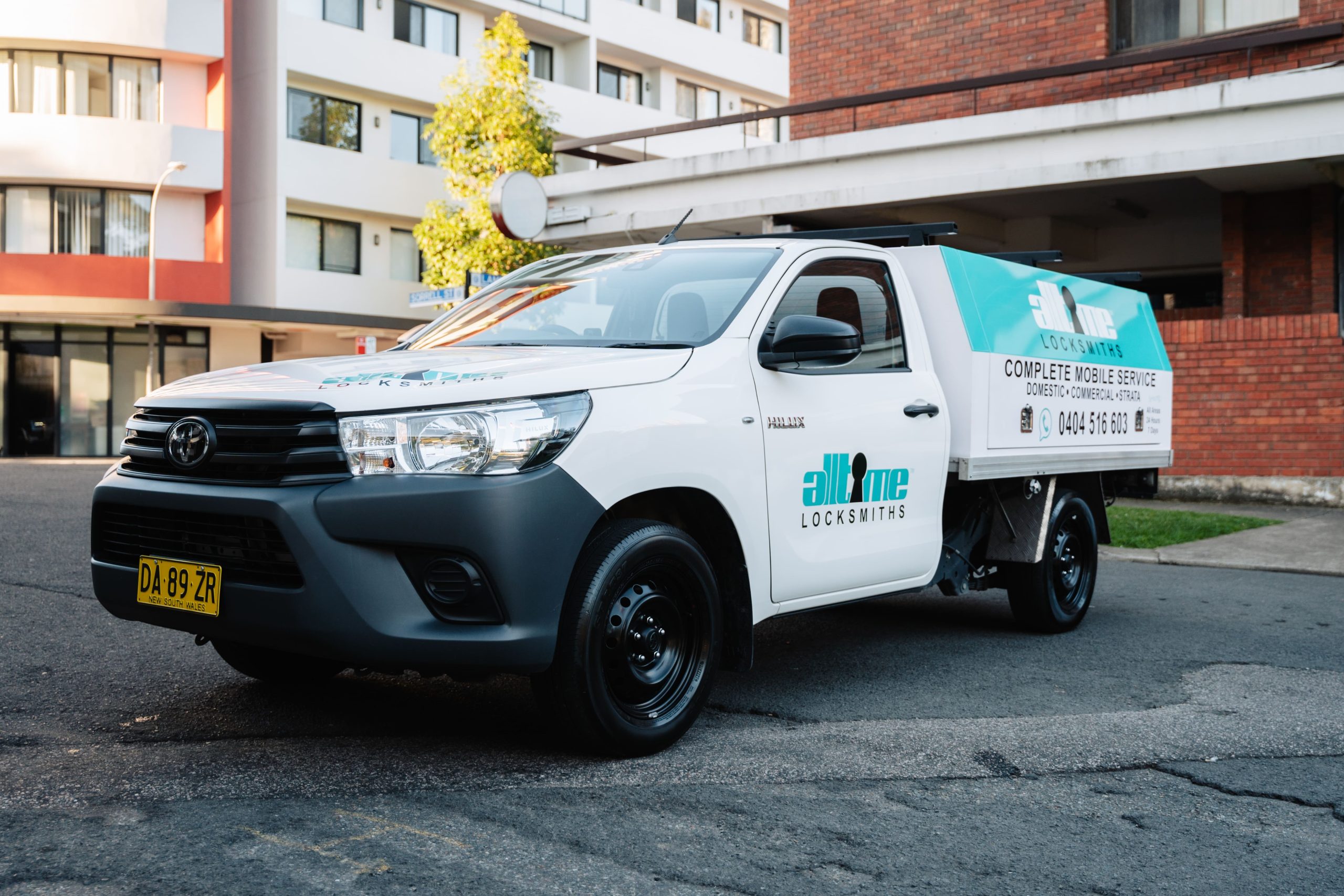 All Time Locksmiths mobile service vehicle outside a Sydney apartment building